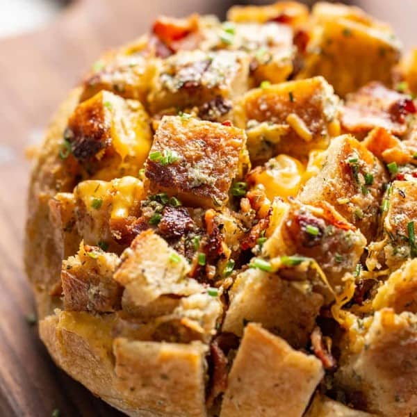 Close up of cheesy ranch pull-apart bread on a cutting board