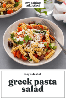 Greek pasta salad with a fork in a white bowl. Text overlay includes recipe name.