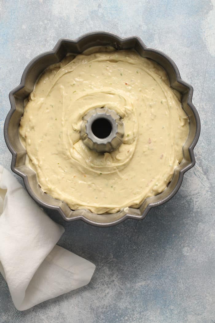 Lime coconut cake batter in a bundt pan, ready to be baked