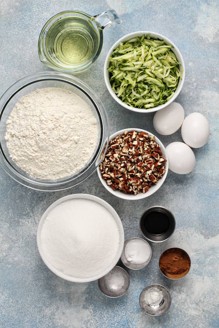 Ingredients for zucchini bread arranged on a countertop