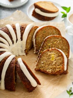 Sliced zucchini bundt cake on a piece of parchment paper