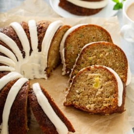 Sliced zucchini bundt cake on a piece of parchment paper