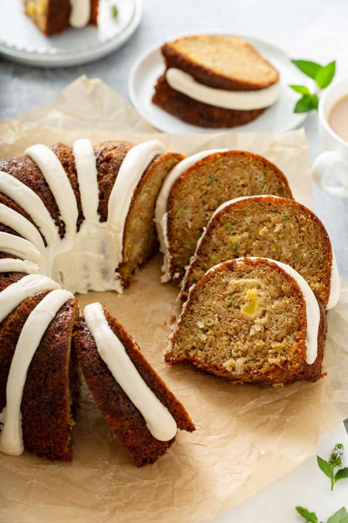 Sliced zucchini bundt cake on a piece of parchment paper