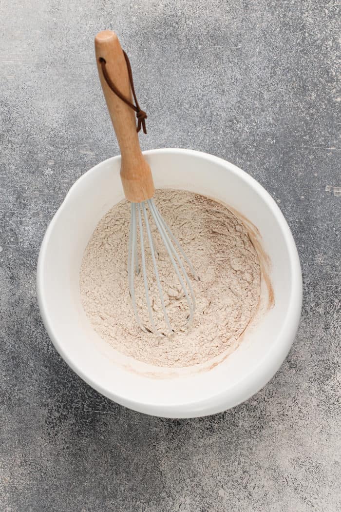 Whisk stirring together the dry ingredients for zucchini cake