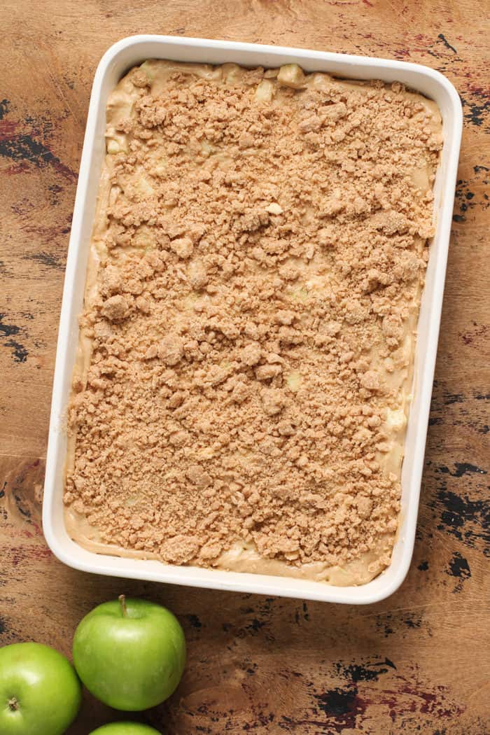 Apple coffee cake batter in a baking dish, ready to be baked