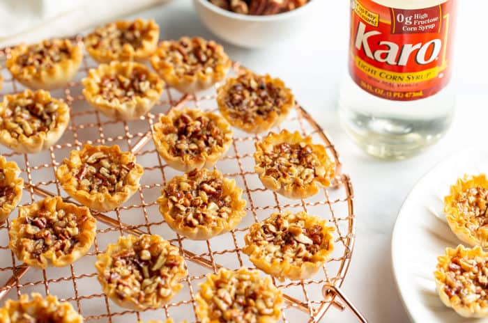 Mini Pecan pies cooling on a wire cooling rack