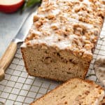 Sliced apple fritter bread set on a wire cooling rack