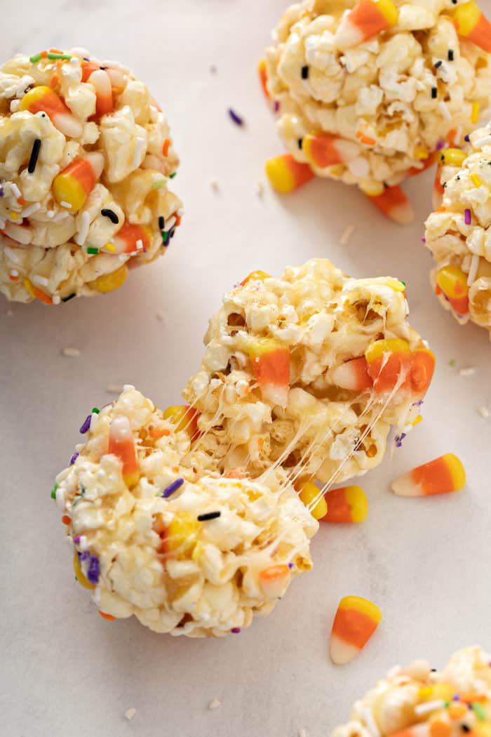 Halloween popcorn ball torn apart to show the sticky inside