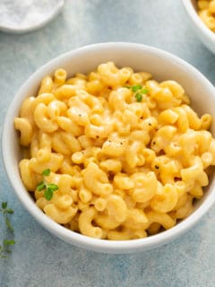 Close up of a white bowl filled with one pot mac and cheese