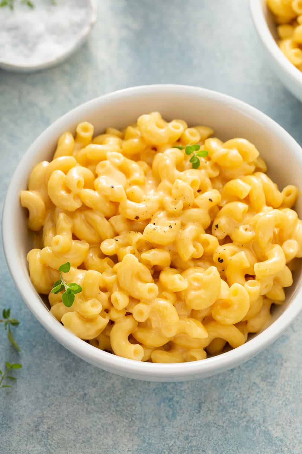 Close up of a white bowl filled with one pot mac and cheese