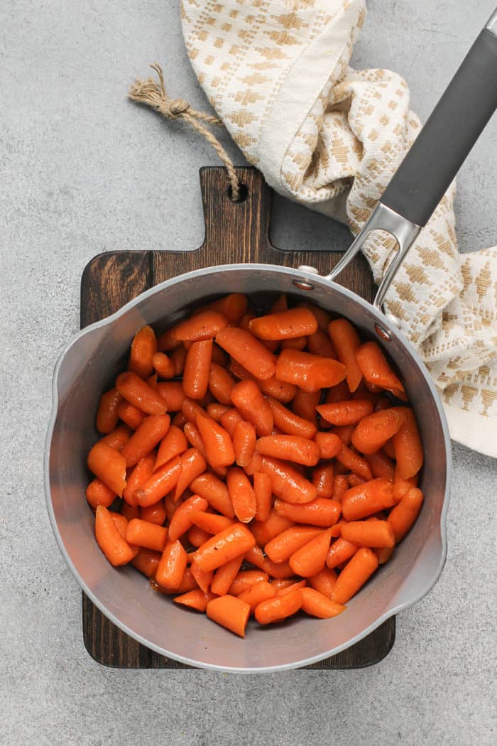 Overhead view of carrots being cooked in a saucepan