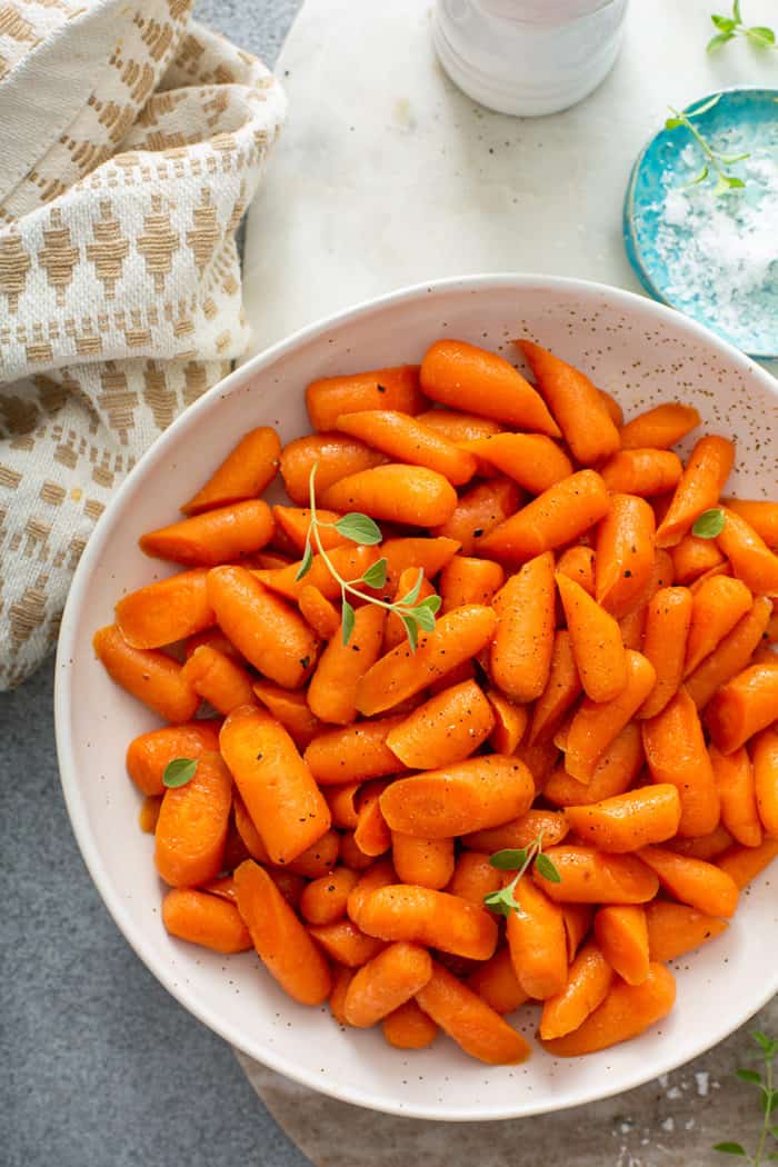 White bowl filled with honey glazed carrots