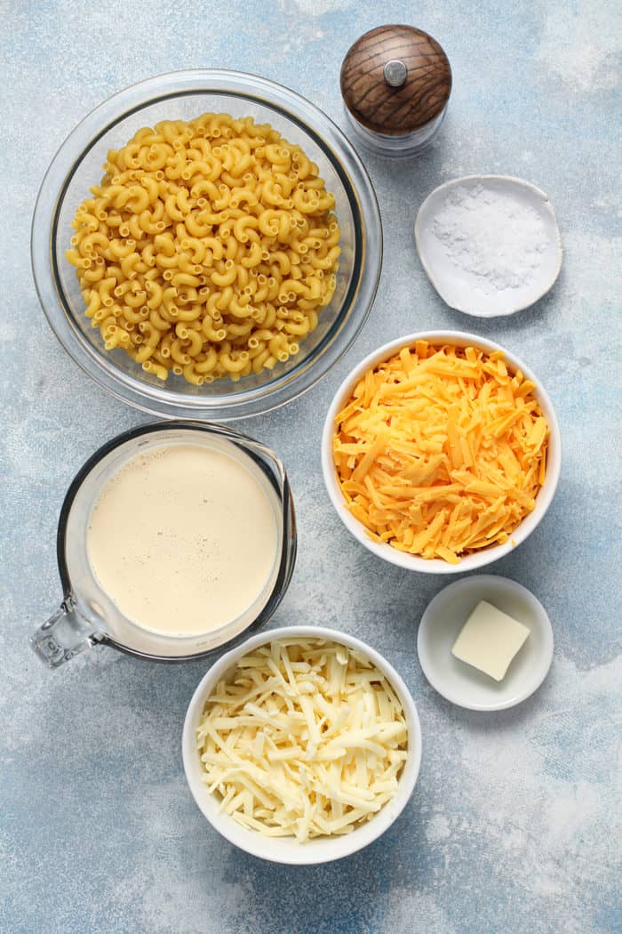 Ingredients for one pot mac and cheese arranged on a countertop