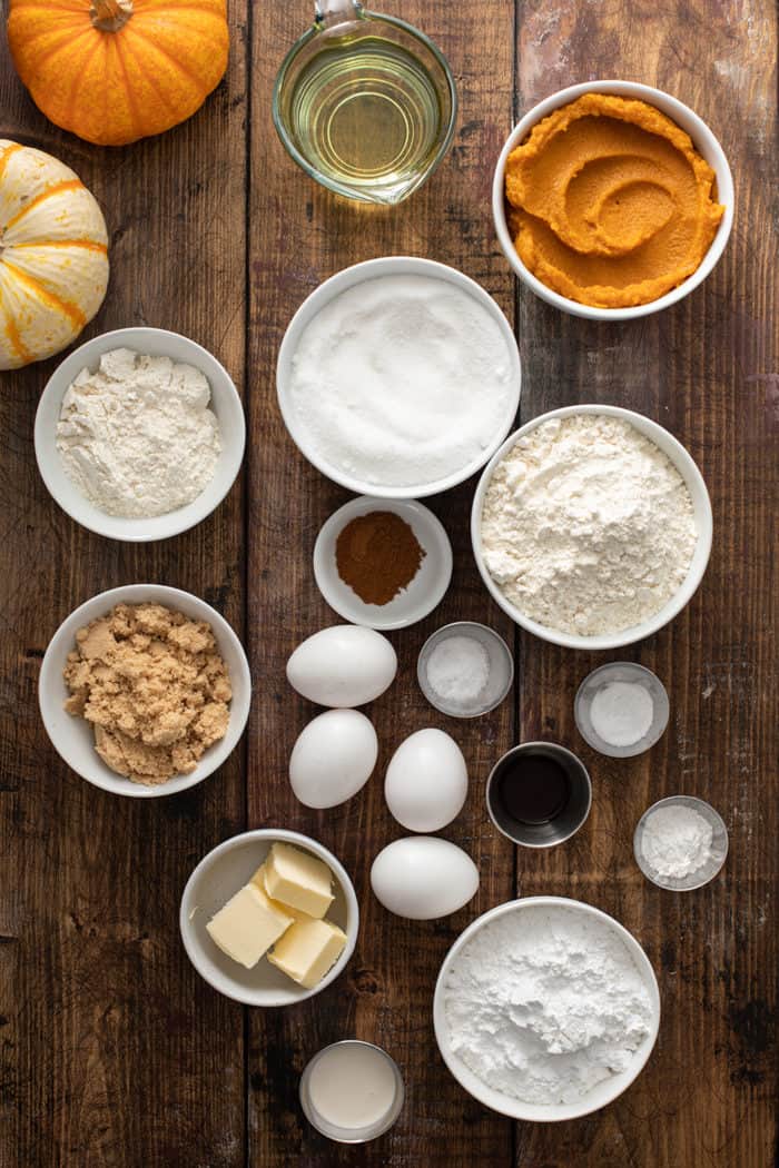 Pumpkin coffee cake ingredients arranged on a wooden table