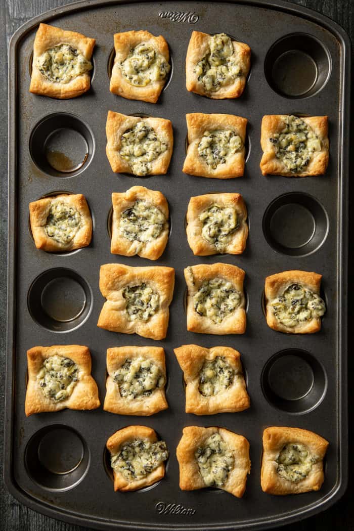 Baked spinach artichoke bites in a mini muffin tin