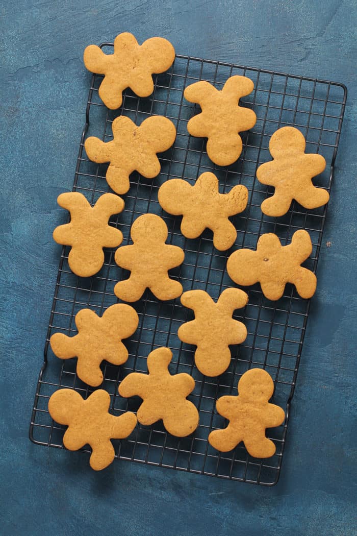 Gingerbread man cutouts cooling on a wire rack