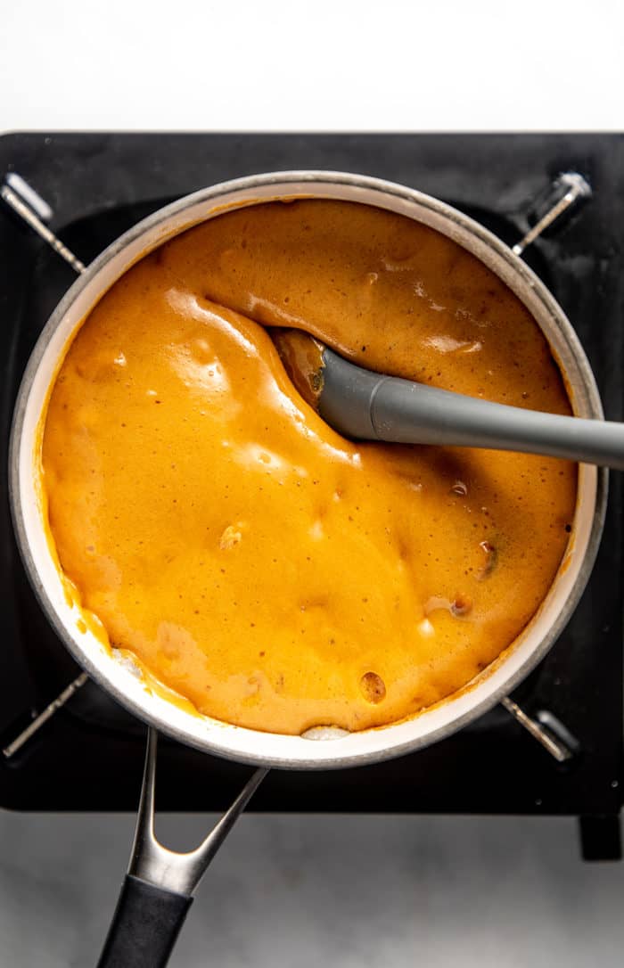 Peanut brittle fully cooked and ready to spread on a baking sheet