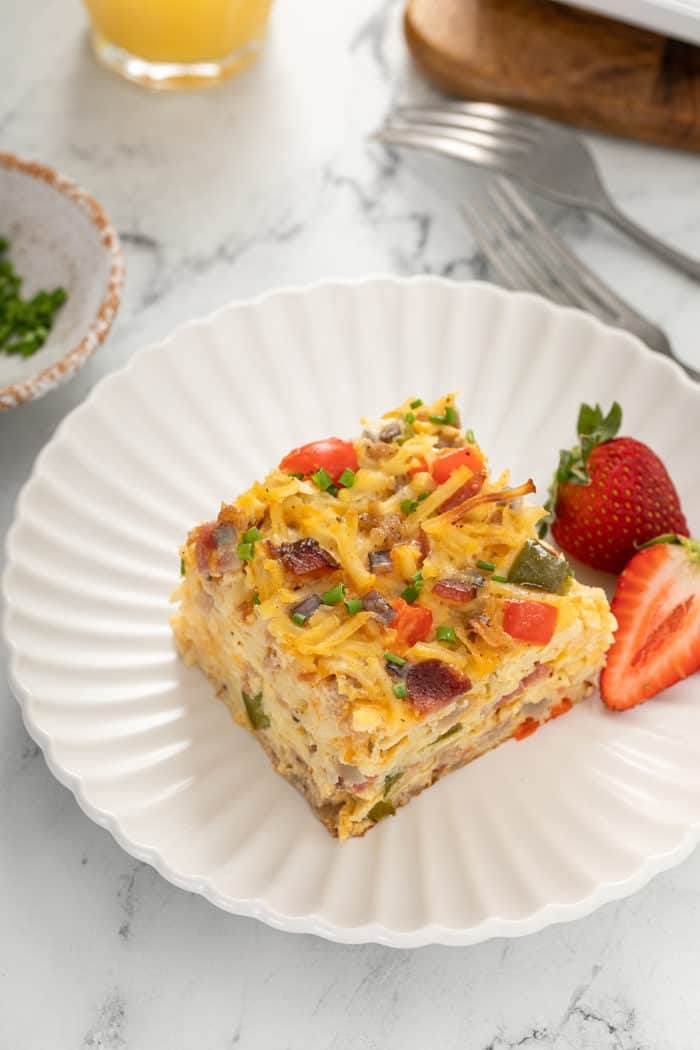 Plated slice of hash brown breakfast casserole on a white plate