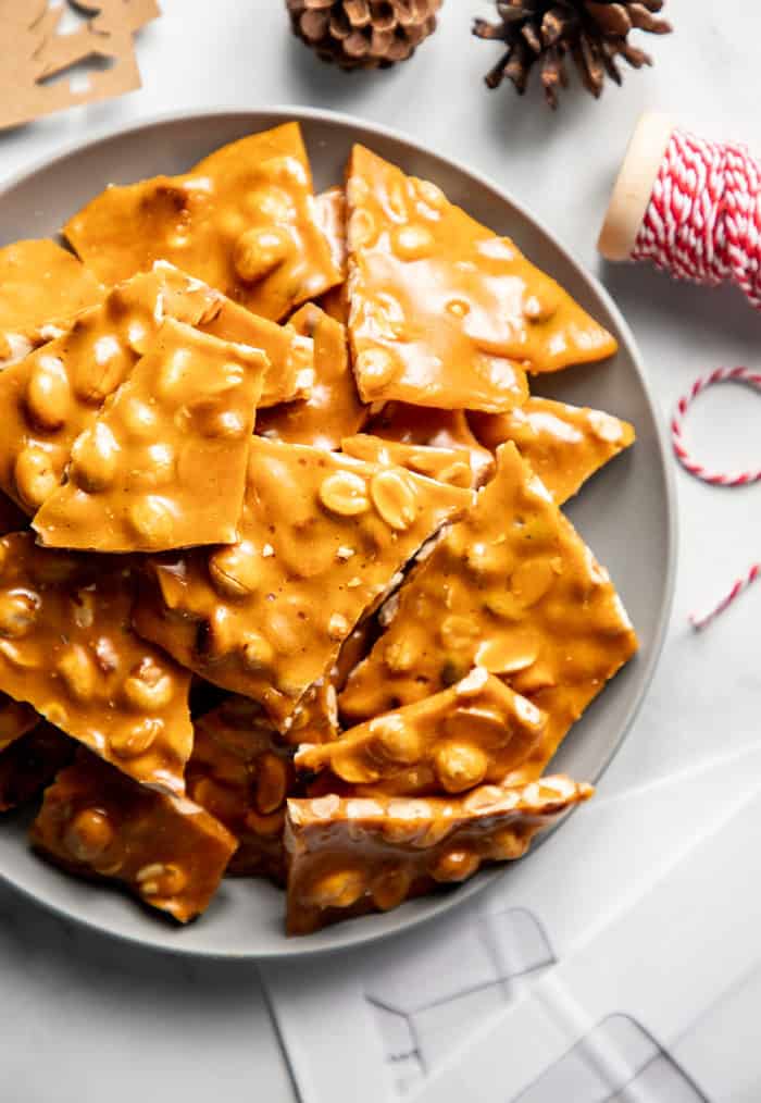 Plate stacked high with pieces of peanut brittle