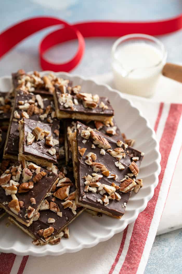 Saltine toffee stacked on a white platter
