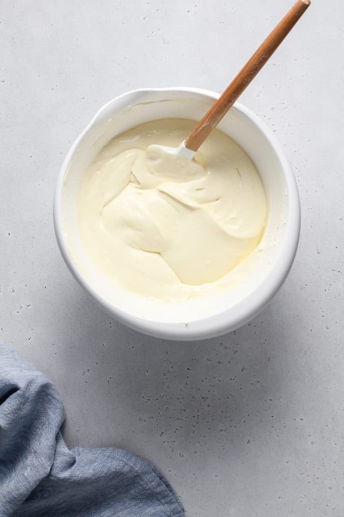 Cheesecake bar filling in a white mixing bowl