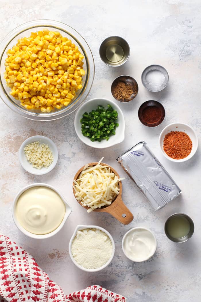 Corn dip ingredients arranged on a white countertop