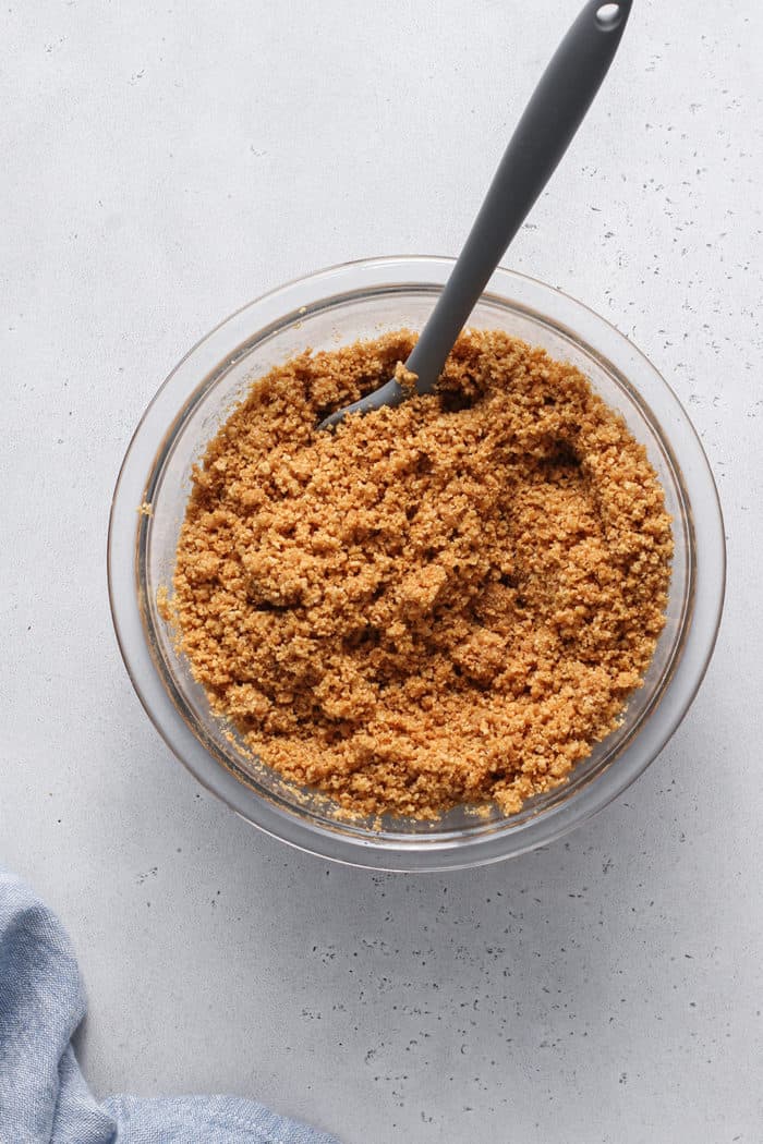 Graham cracker crumbs mixed together with butter and sugar for a graham cracker crust