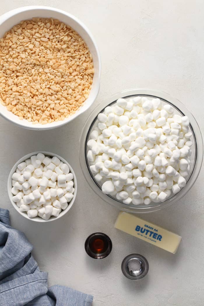 Ingredients for classic rice krispie treats arranged on a white countertop
