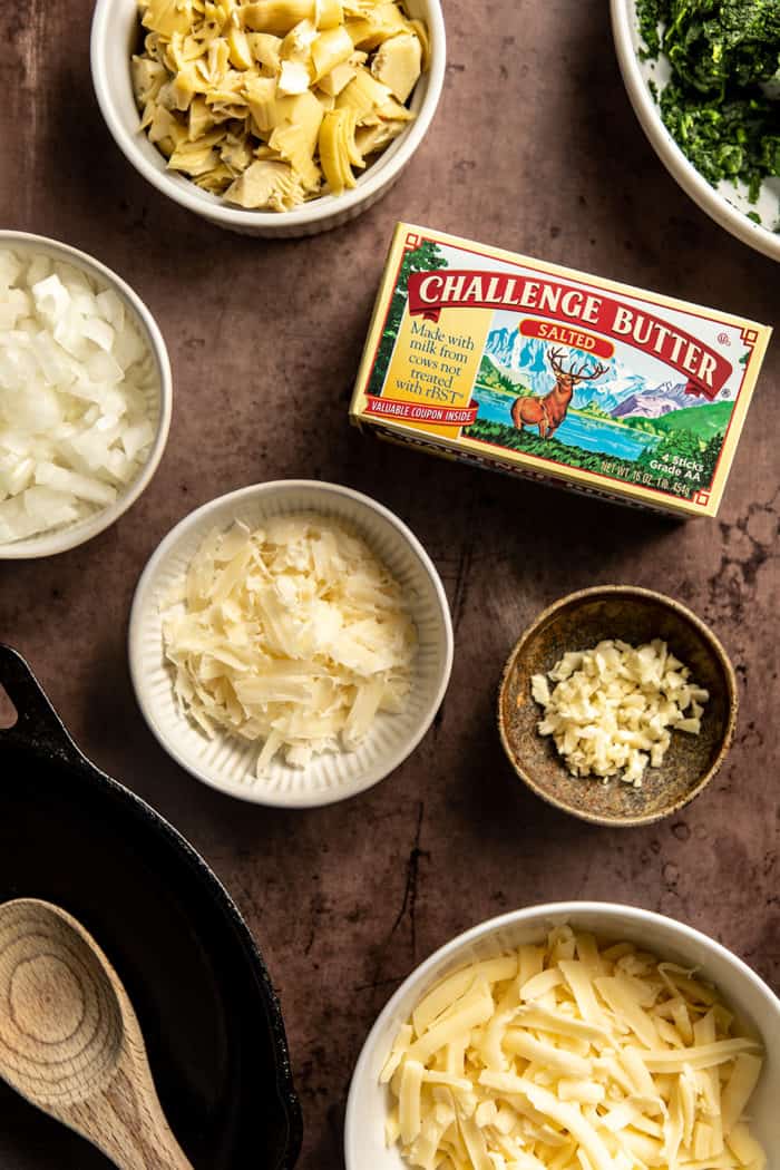 Ingredients for Spinach Artichoke Dip arranged on a countertop