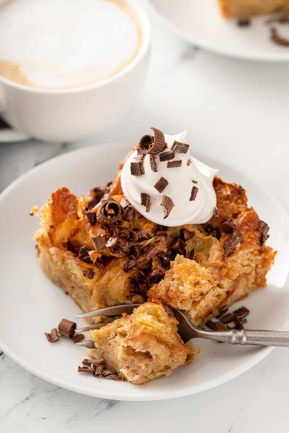 https://www.mybakingaddiction.com/wp-content/uploads/2022/02/taking-bite-chocolate-chip-bread-pudding.jpg