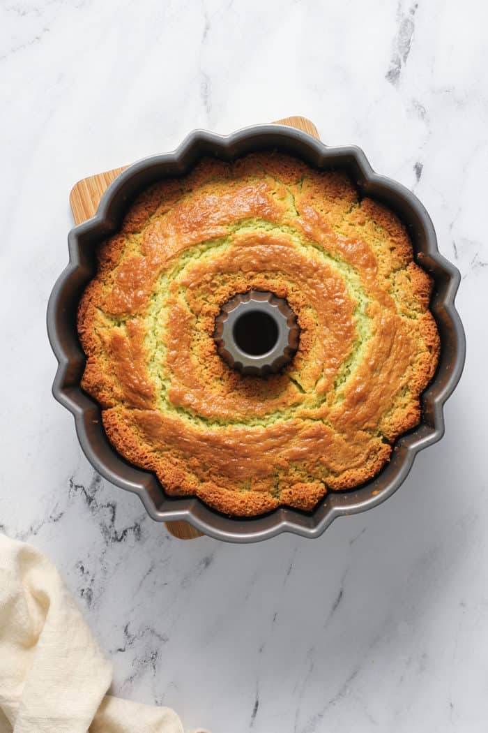 Overhead view of baked pistachio pudding cake in the bundt pan