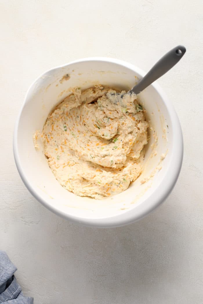 Classic cheese ball mixture in a white mixing bowl