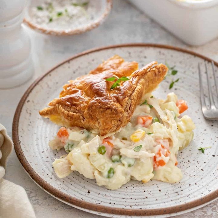 Serving of chicken pot pie casserole on a gray and white plate