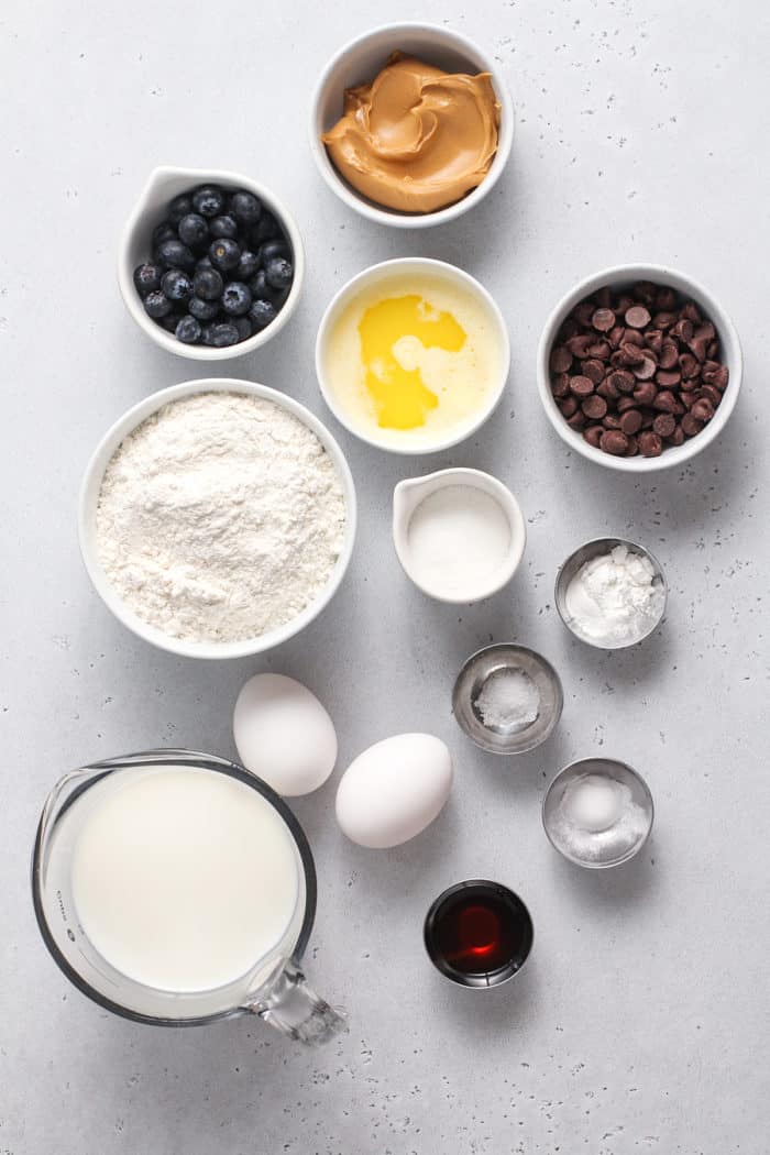 Pancake batter ingredients arranged on a light gray countertop