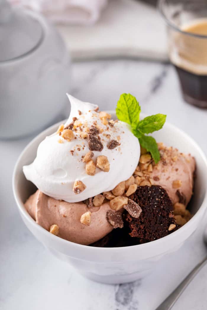 Close up of a serving of brownie trifle in a small bowl.