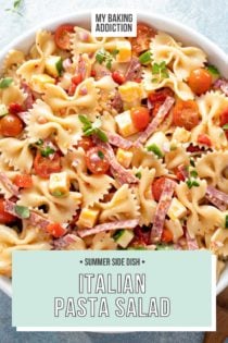 Overhead view of a large white serving bowl filled with italian pasta salad. Text overlay includes recipe name.