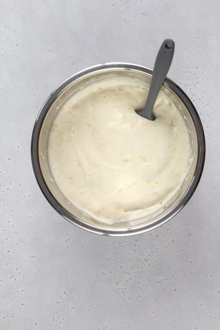 Angel food cake batter in a metal mixing bowl.