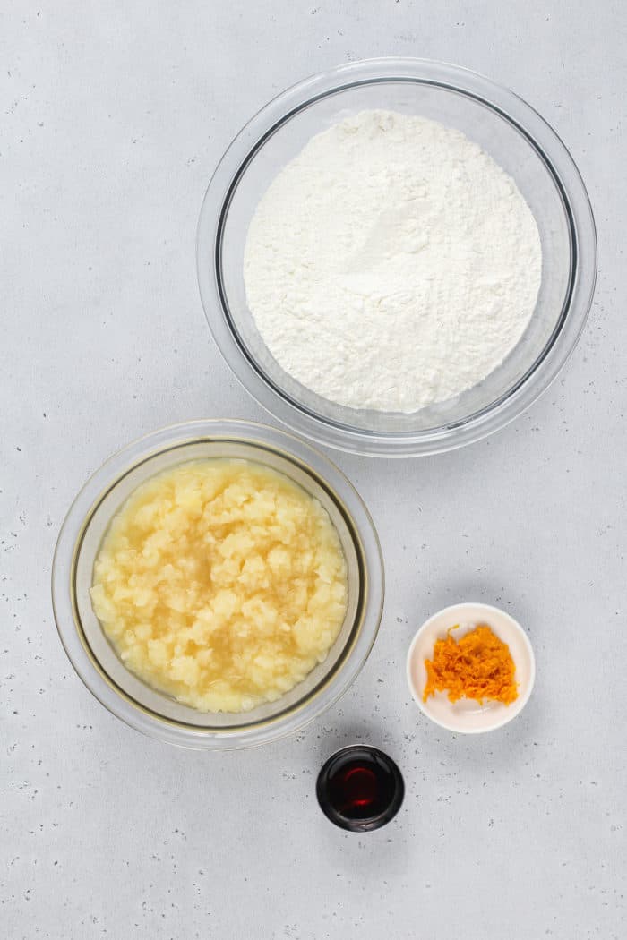 Pineapple angel food cake ingredients arranged on a gray countertop.