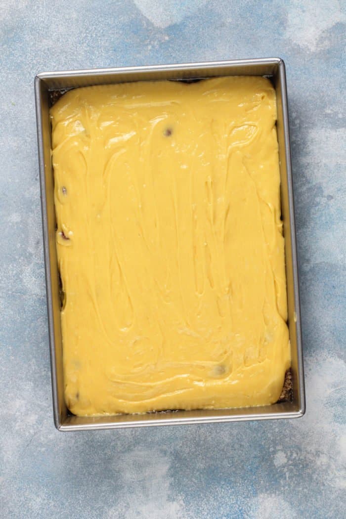 Assembled easy pineapple upside down cake in a cake pan, ready to go in the oven.