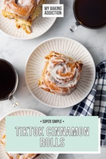 Overhead view of 3 white plates, each with a frosted cinnamon roll on it. Text overlay includes recipe name.