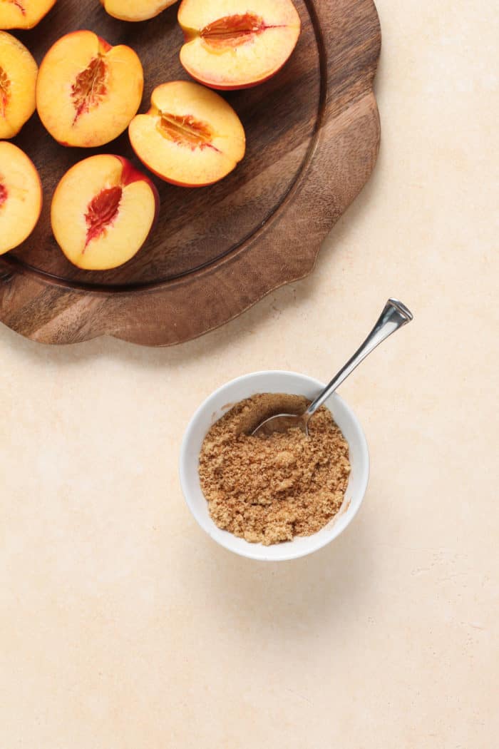 Brown sugar and pumpkin pie spice mixed together in a small white bowl.