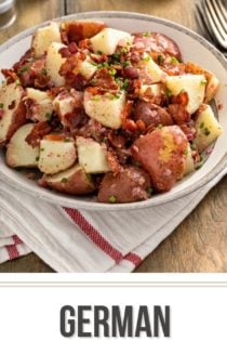 German potato salad, garnished with bacon and chives, in a large serving bowl. Text overlay includes recipe name.