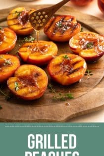 Honey being drizzled over grilled peach halves arranged on a wooden platter. Text overlay includes recipe name.