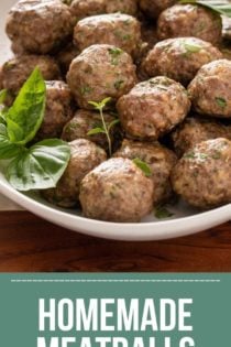 Portioned and rolled meatballs on a lined baking sheet, ready to be baked. Text overlay includes recipe name.