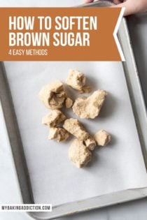 Clumps of hard brown sugar on a parchment-lined baking sheet. Text overlay includes post name.