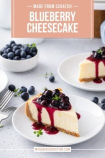 Two white plates with slices of blueberry cheesecake. A cake plate with the rest of the cheesecake can be seen in the background. Text overlay includes recipe name.