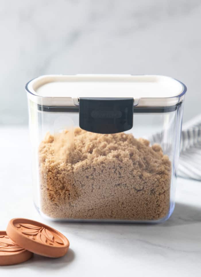 Soft brown sugar inside of a closed airtight container.
