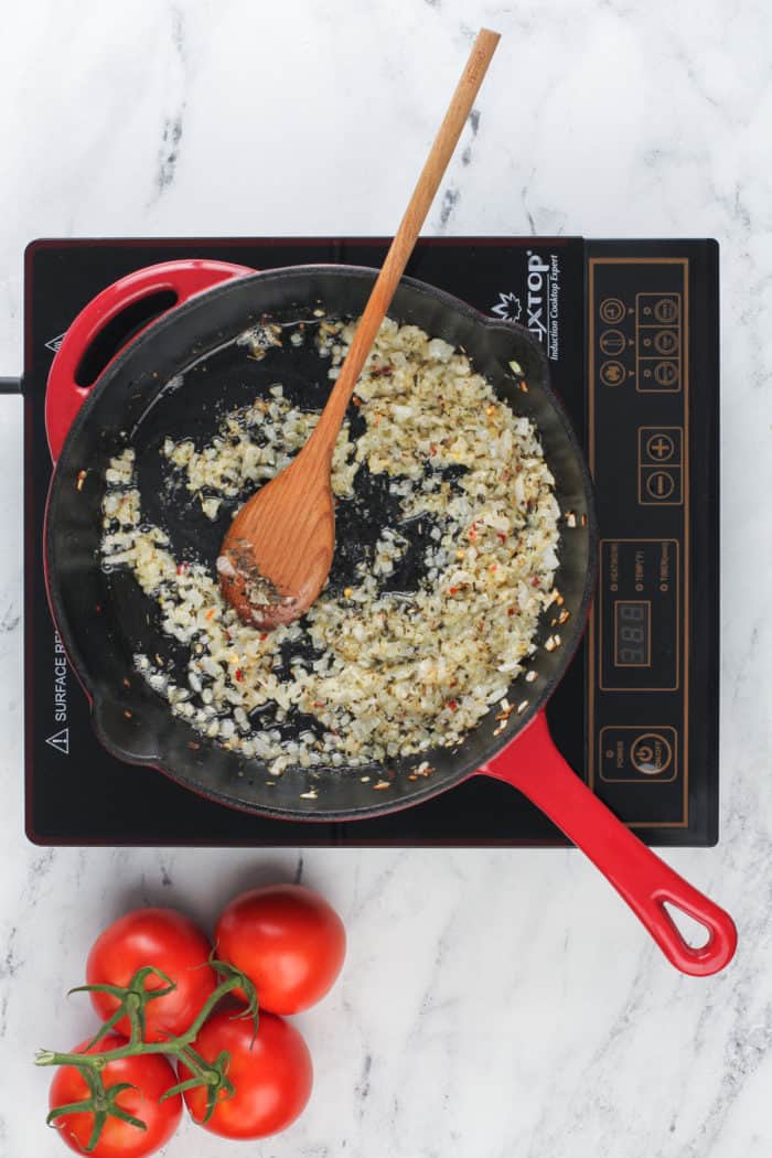 Cooked onions and garlic in a cast iron skillet.