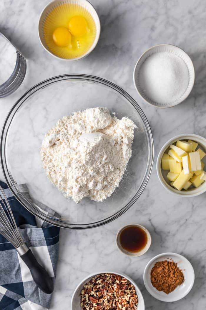 Easy coffee cake batter ingredients arranged on a marble countertop.