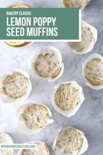 Glazed lemon poppy seed muffins in their wrappers scattered on a marble countertop. Text overlay includes recipe name.